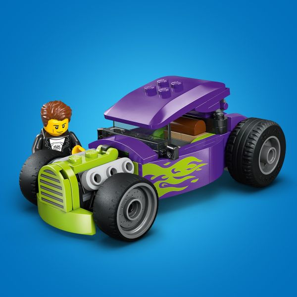 Purple bodywork with neon flames and oversized rear tires.