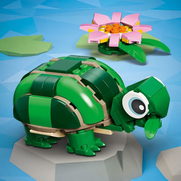 Cute turtle with a pink flower has a posable head and mouth.