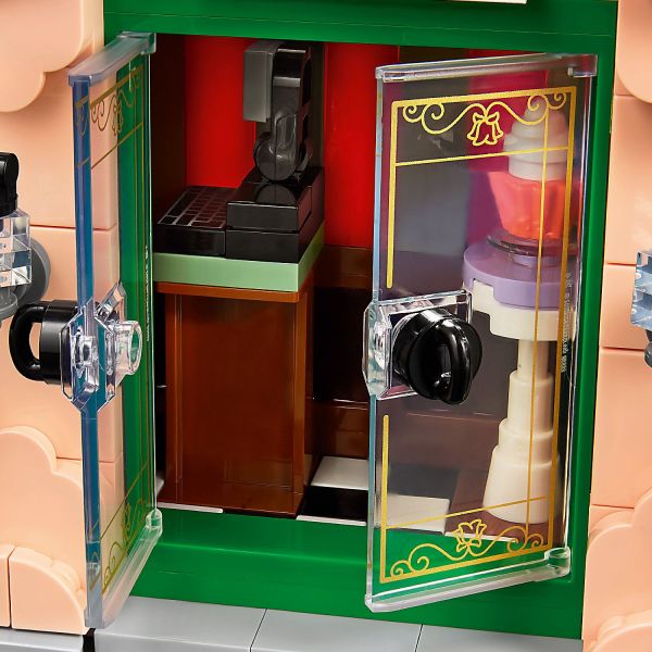Double doors open to reveal a glimpse of a cozy interior.