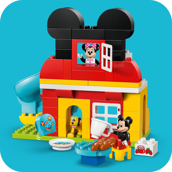 Mickey Mouse’s iconic ears top this colorful building.