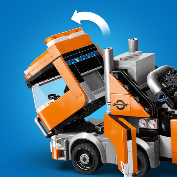 Both trucks have tilting cabs with side-by-side seating.