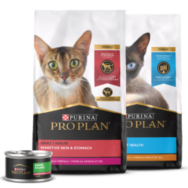 Bags of Pro Plan Sensitive Skin & Stomach and Urinary Tract Health dry cat food and one can of Sensitive Skin and Stomach wet cat food.
