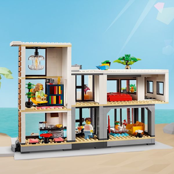 Modern beach house has a balcony and a swimming pool.
