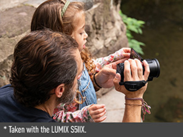 Family capturing memories at the park using the Panasonic HC-VX3 camcoder