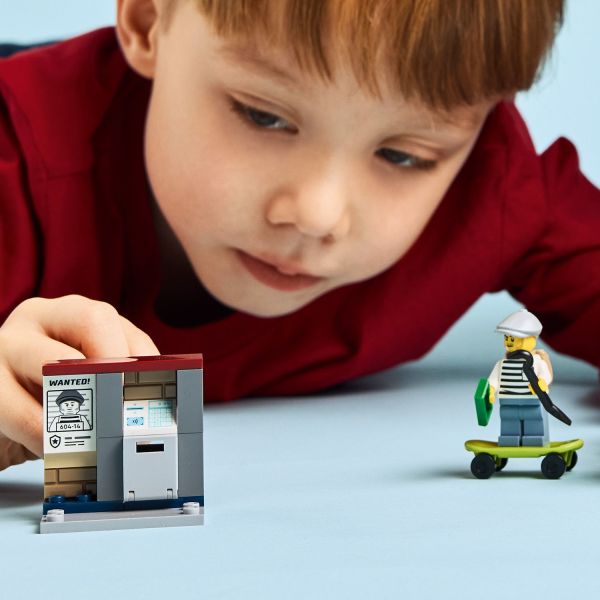 Crook’s getaway skateboard and an ATM with a toy banknote.