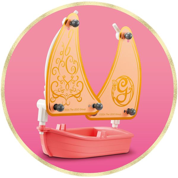 Boat toy with sail steers Glinda safely to shore.