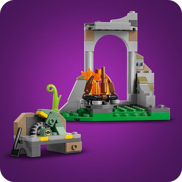 The playset features a campfire, workbench and ruins.