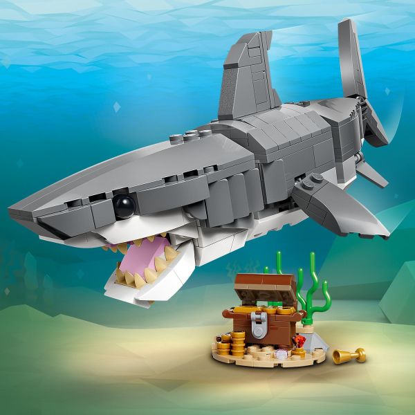Posable shark comes with a treasure chest.