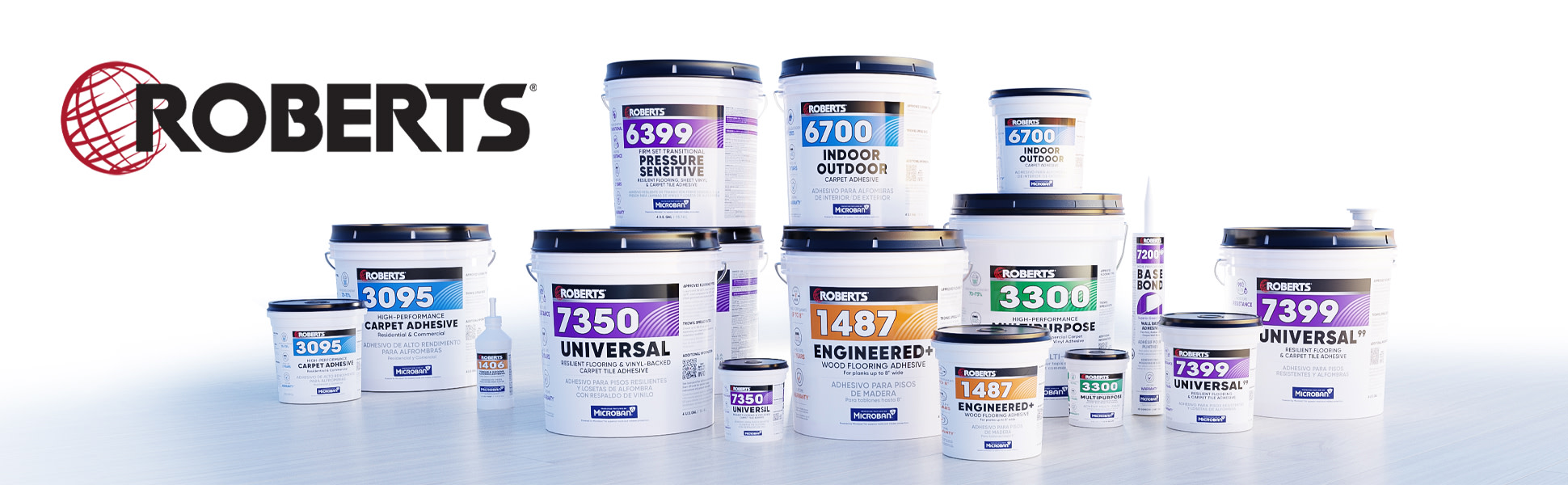 A variety of ROBERTS® flooring adhesives arranged in a well-lit setting