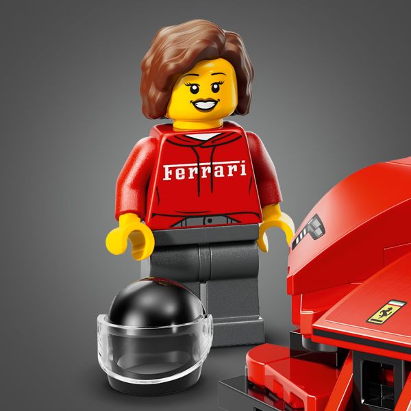 Minifigure wearing a Ferrari outfit and helmet.