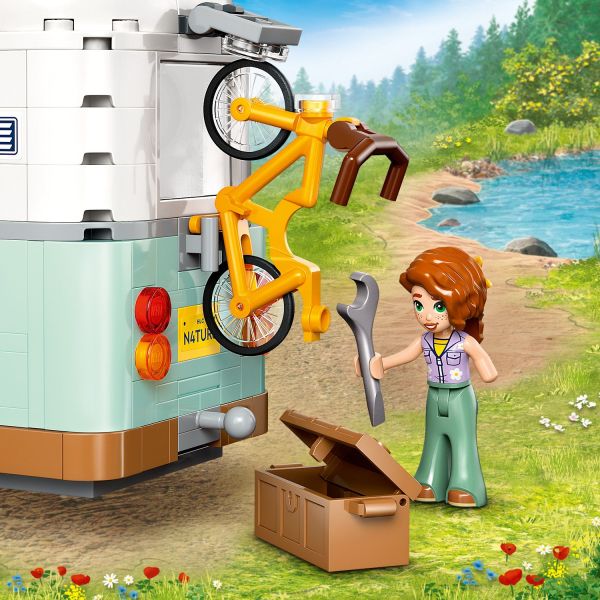 The bicycle comes with accessories and attaches to the van.