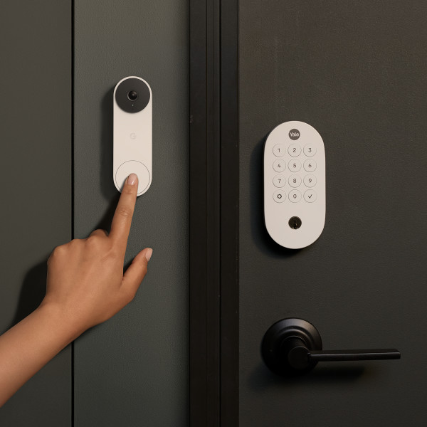 Man unlocking door lock with key