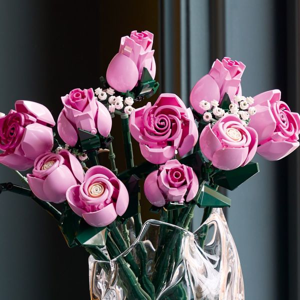 The flower arrangement is a gorgeous shade of pink.