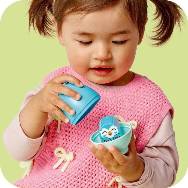 Toddlers use fine motor skills to open the tactile eggs.