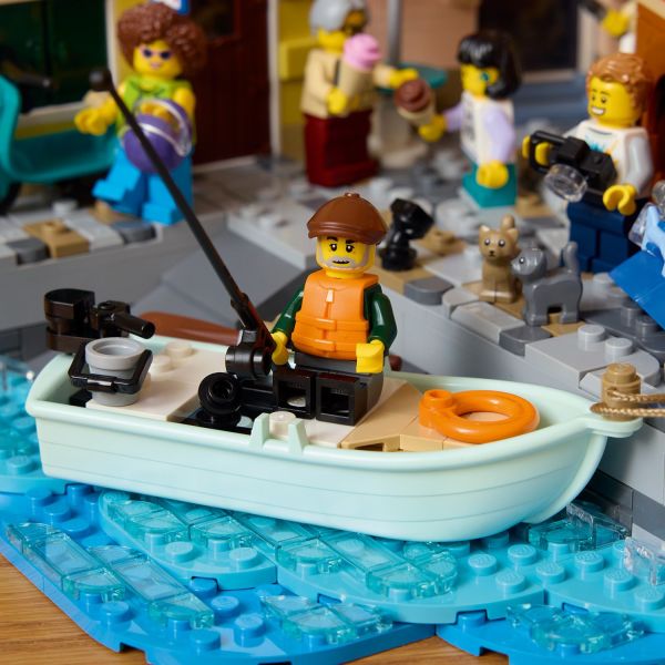 A fisher in the boat on the brick-built sea.