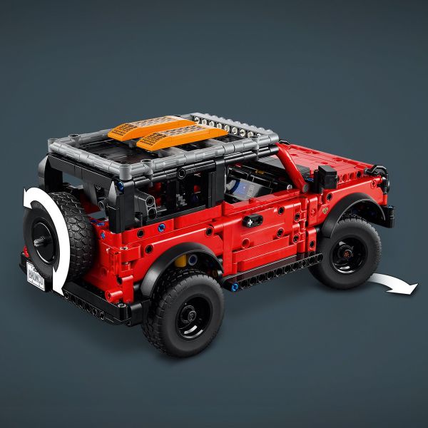 Steer the SUV using the spare wheel on the rear of the car.