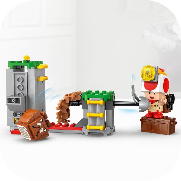 Collapse the bridge to topple the Goomba toy figure.