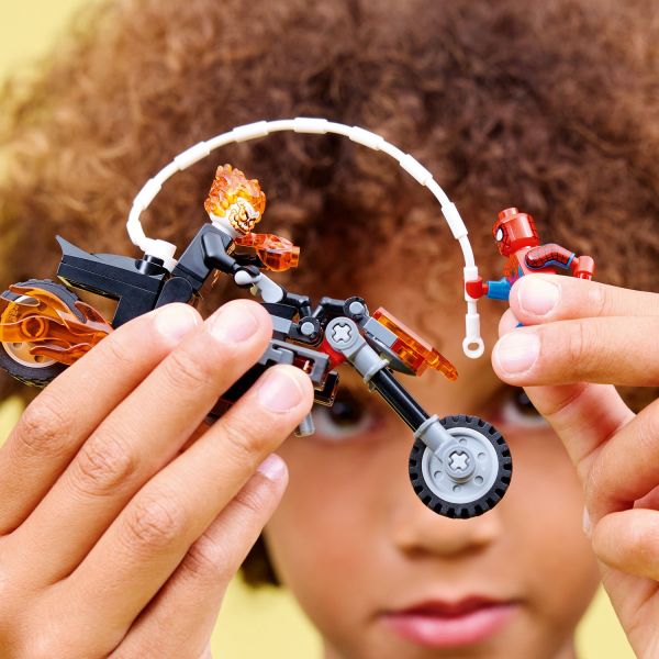 Use the hero’s web rope to swing onto the fiery motorcycle.