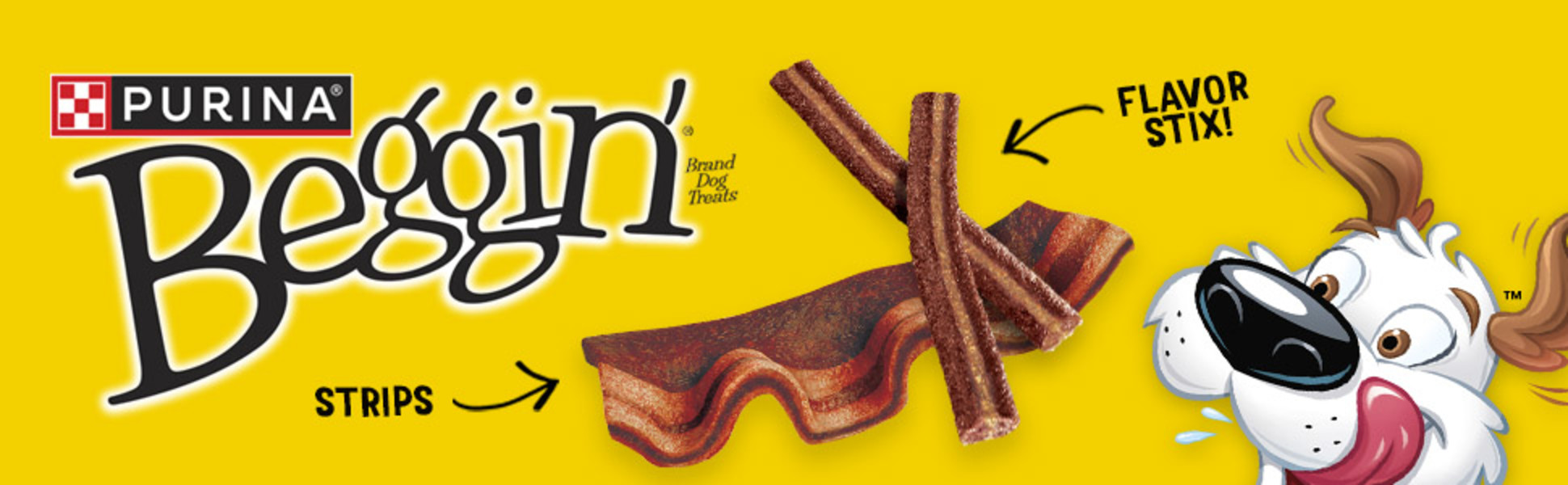 Hamlet the dog licks his lips while looking at Beggin’ Strips and Stix treats.