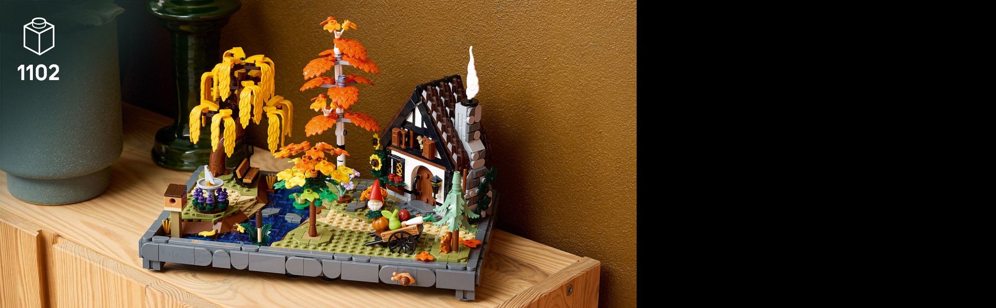 Capture the warmth of fall with this addition to the Gardens of the World collection, inspired by classic storybook cottages.