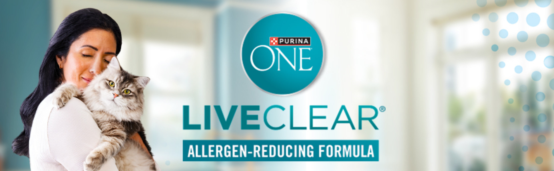 WOMAN SHARING A HUG WITH HER LONG-HAIRED CAT