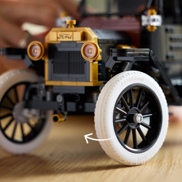 Features tall, spoked rims with slim white rubber tires.
