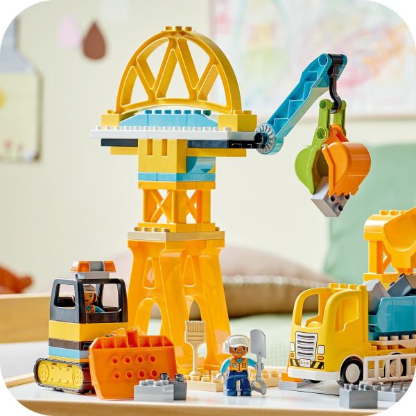 Crane has a movable arm and a bucket that grabs.