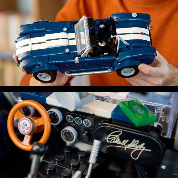 Sleek blue bodywork with Shelby’s autograph and white racing stripes.