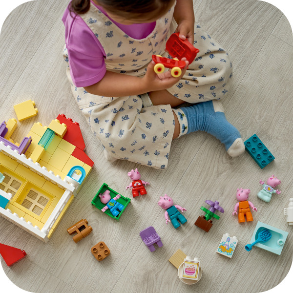 Building with bricks can help toddlers develop dexterity.