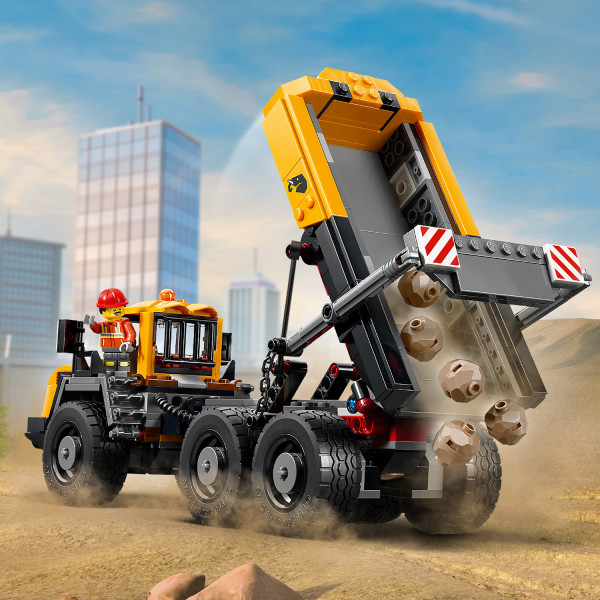 Equipped with rugged suspension and a tipping cargo bed.