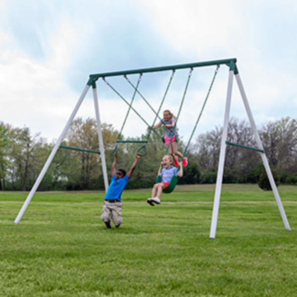 A group of three children swinging on a Big Brutus Swing Set