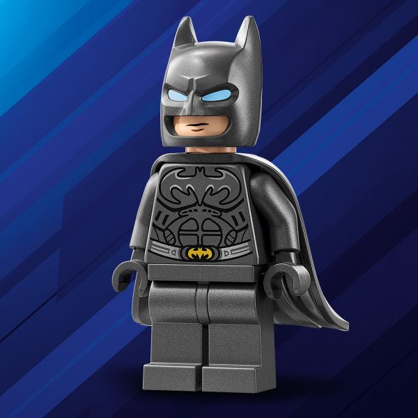 Place the Caped Crusader alongside the Batmobile .