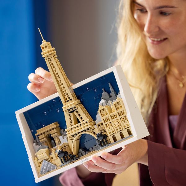The Eiffel Tower extends beyond the frame to make a statement.