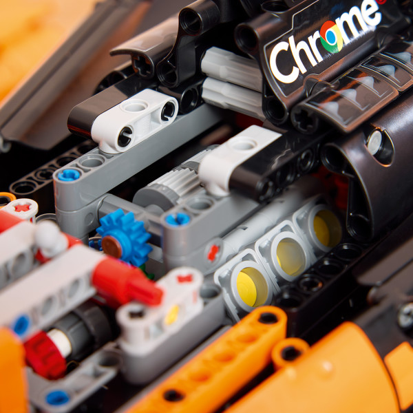 Remove the engine cover to examine the car’s V6 engine.