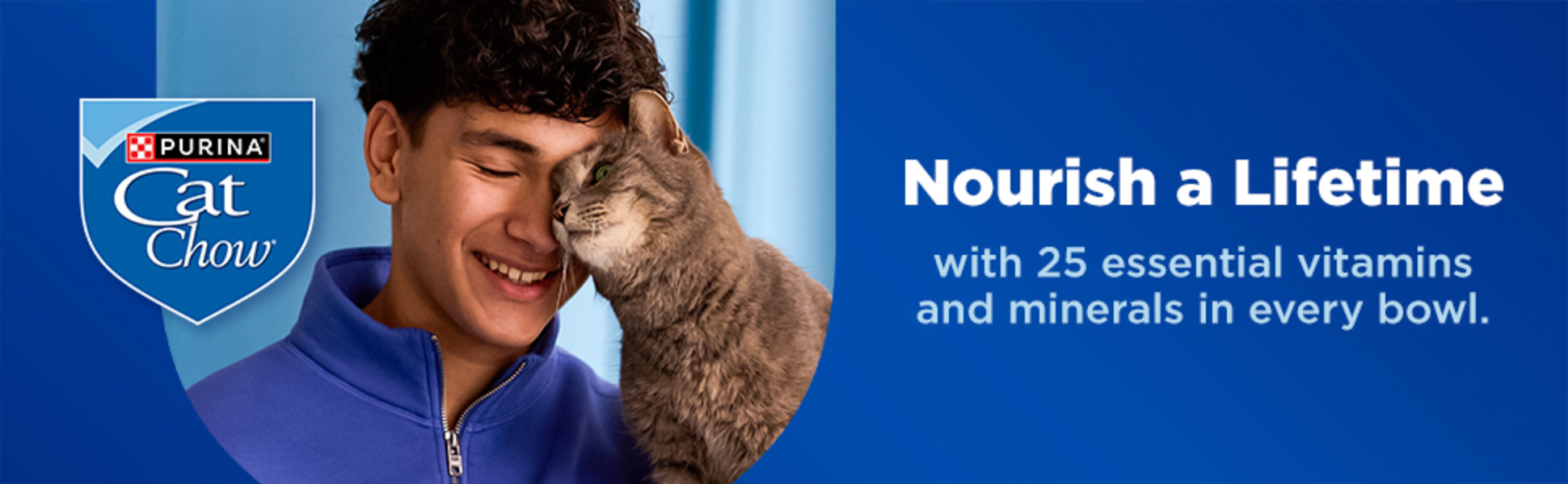 A young man is holding and petting a cat while a blue Purina Cat Chow shield logo appears nearby.