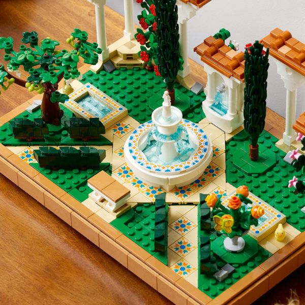 Decorative tiled pathways lead to the 2-tiered fountain.