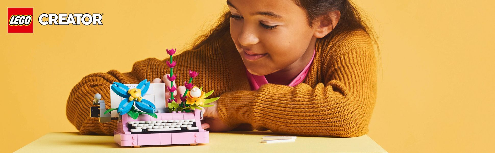 Kids build a vintage Typewriter with Flowers toy, then rebuild it into a keytar toy or flowerpot in a LEGO Creator 3in1 set.