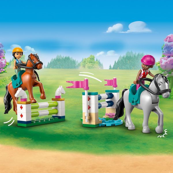 The friends love to ride the horses over the jumps.