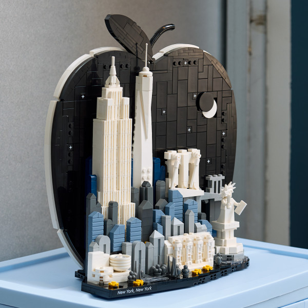 Backdrop highlights iconic buildings and Central Park details.