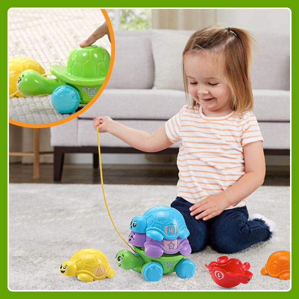 Kid pulls turtles with pull-cord. Inset shows kid pressing button to make turtles’ head stick out.