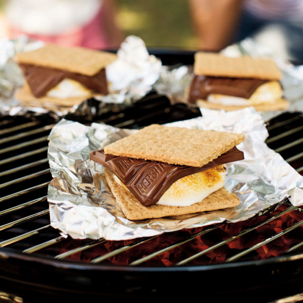 S'mores cooking on top of aluminum foil on the grill