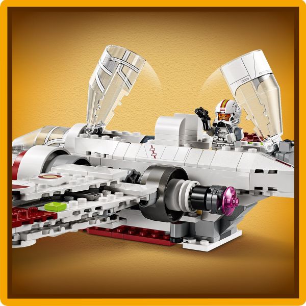 Place the 3 LEGO Star Wars minifigures in the cockpits.