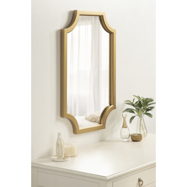 scalloped gold mirror over dresser or makeup station in bedroom