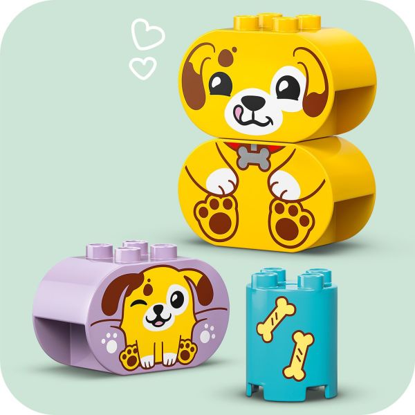 Toddlers build bricks to create a dog and its pup.