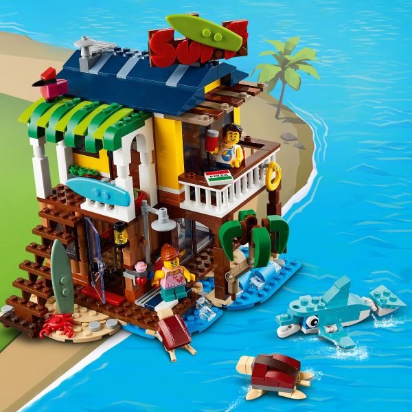 2-floored surf house includes a dolphin and sea turtle.