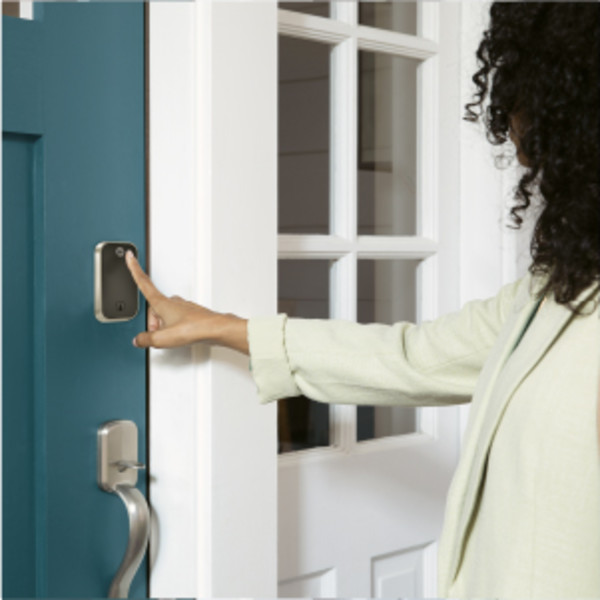 Man unlocking door lock with key
