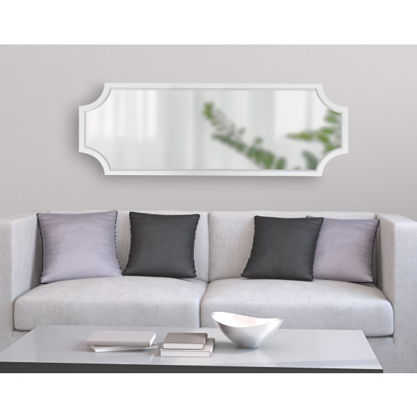 white mirror over sofa in living room