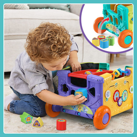 Kid sorts brightly colored, star, square, triangle and circle blocks into shape sorter.