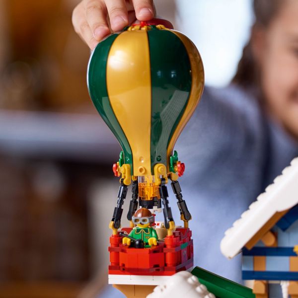 Press the top of the hot-air balloon to light up the burner.