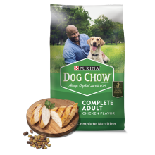 Bag of Dog chow complete adult chicken flavor with a plate of baked chicken and dog kibble